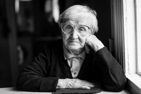 Elderly woman in glasses — Stock Photo, Image