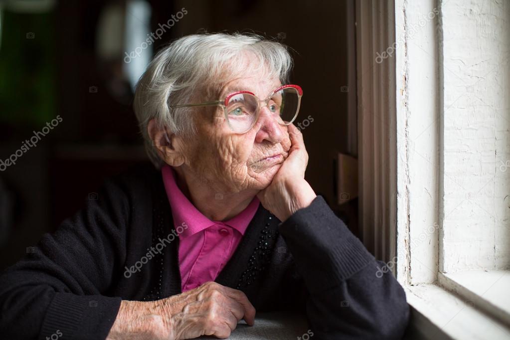 Elderly woman in glasses