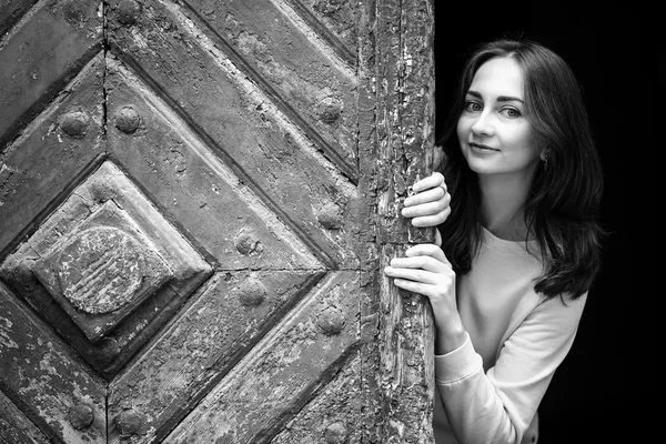 Pretty young girl peering — Stock Photo, Image