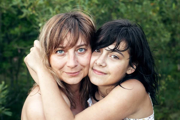 Daughter Teen Girl Hugging Her Happy Mother Closeup Outdoors — Zdjęcie stockowe