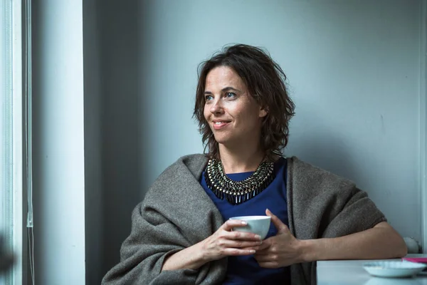 Woman Looks Out Window Her Home — Stock Photo, Image