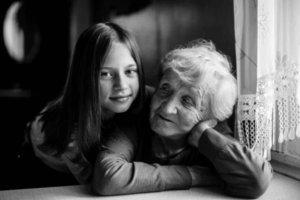 Granny Little Cute Girl Hugs Her Old Grandmother Black White — Stock Photo, Image
