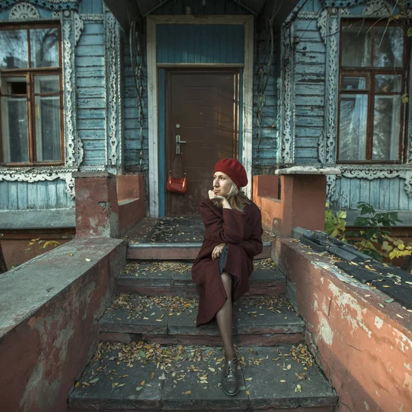 Woman Burgundy Coat Beret Patiently Waiting Sitting Porch Old Wooden — Stock Photo, Image