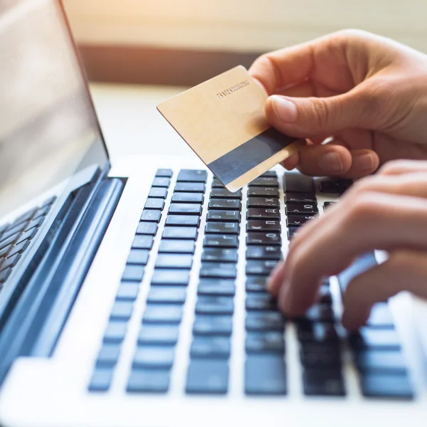 Hands with credit card and laptop — Stock Photo, Image