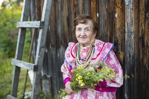 Old woman in ethnic clothes — Stock Photo, Image