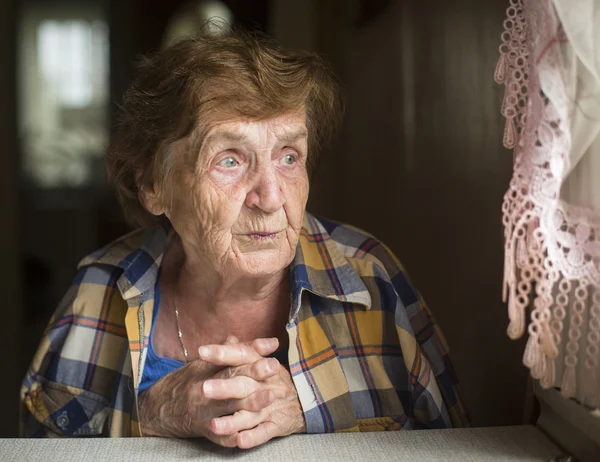 Portrait of a lonely old woman — Stock Photo, Image