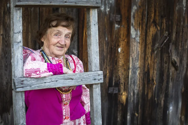 Old woman in Slavic folk clothes — Stock Photo, Image