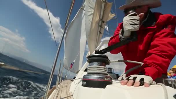 Sailors participate in sailing regatta "12th Ellada Autumn 2014" on Aegean Sea. — Stock Video