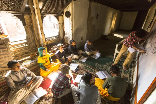 Unknown teacher and students at school — Stock Photo, Image