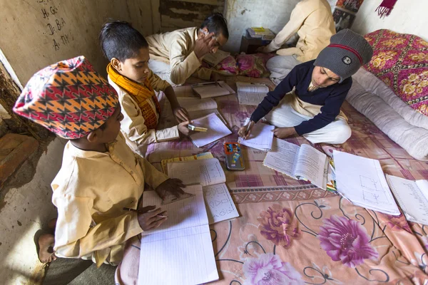 Unknown children doing homework — Stock Photo, Image