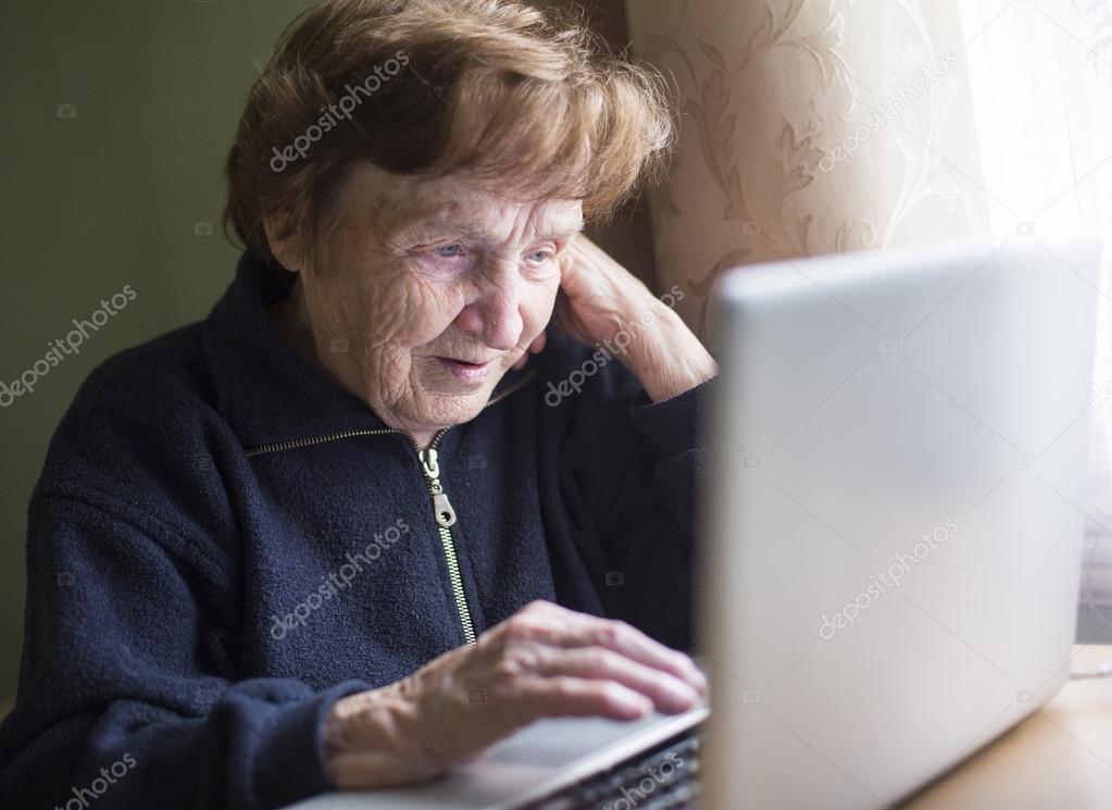 Mature woman working on laptop.