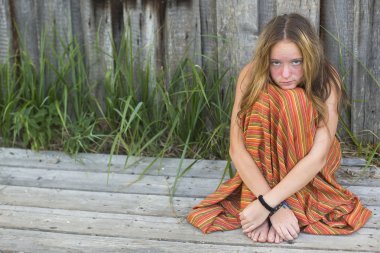 Young hippie girl sitting clipart