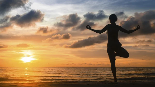 Silhouette of young woman yoga — Stock Photo, Image