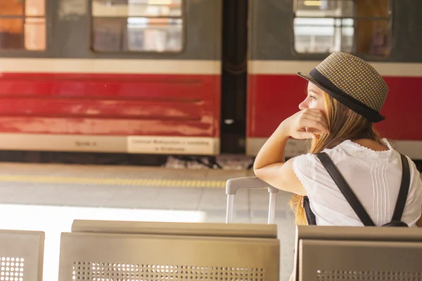 Cute girl waiting for the train — Stok fotoğraf