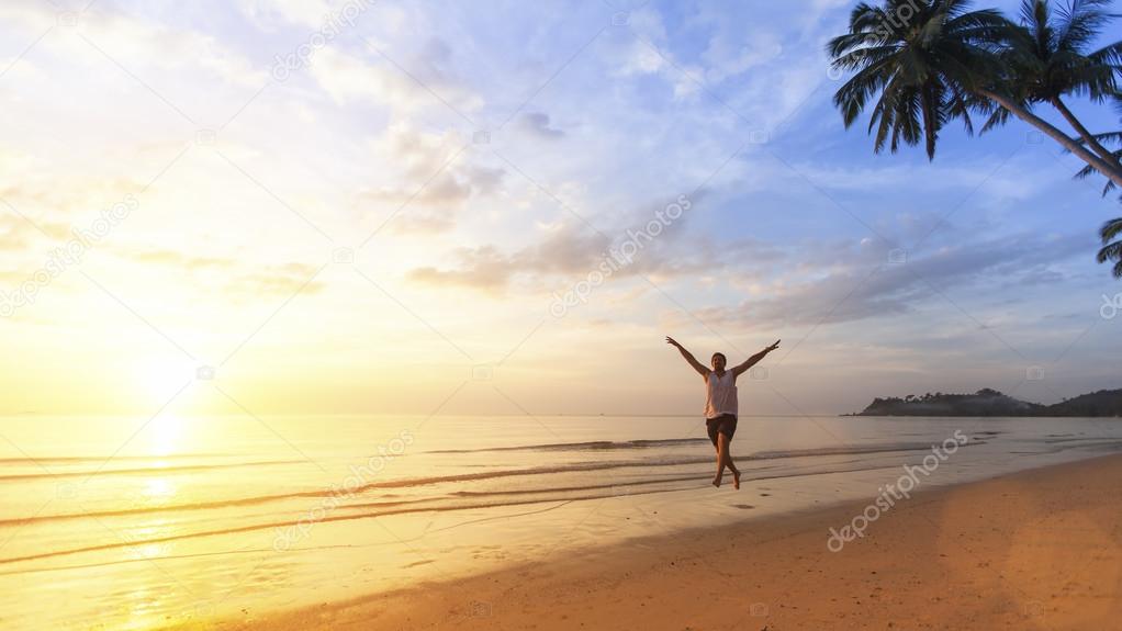 Young man happily jumping