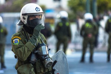 Riot police with their shields clipart