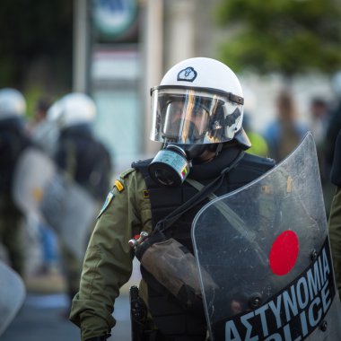 Riot police with their shields clipart