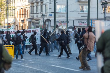 Leftist and anarchist clashed with riot police clipart