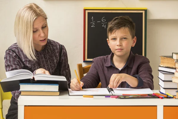 Boy engaged in the lessons at home — Stock Photo, Image