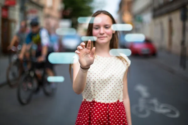 Teen girl presses imaginary button — Stock Photo, Image