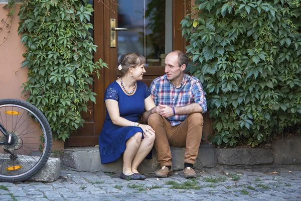 Couple in love sitting on the steps — Stock Photo, Image
