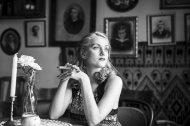 young retro lady at vintage cafe