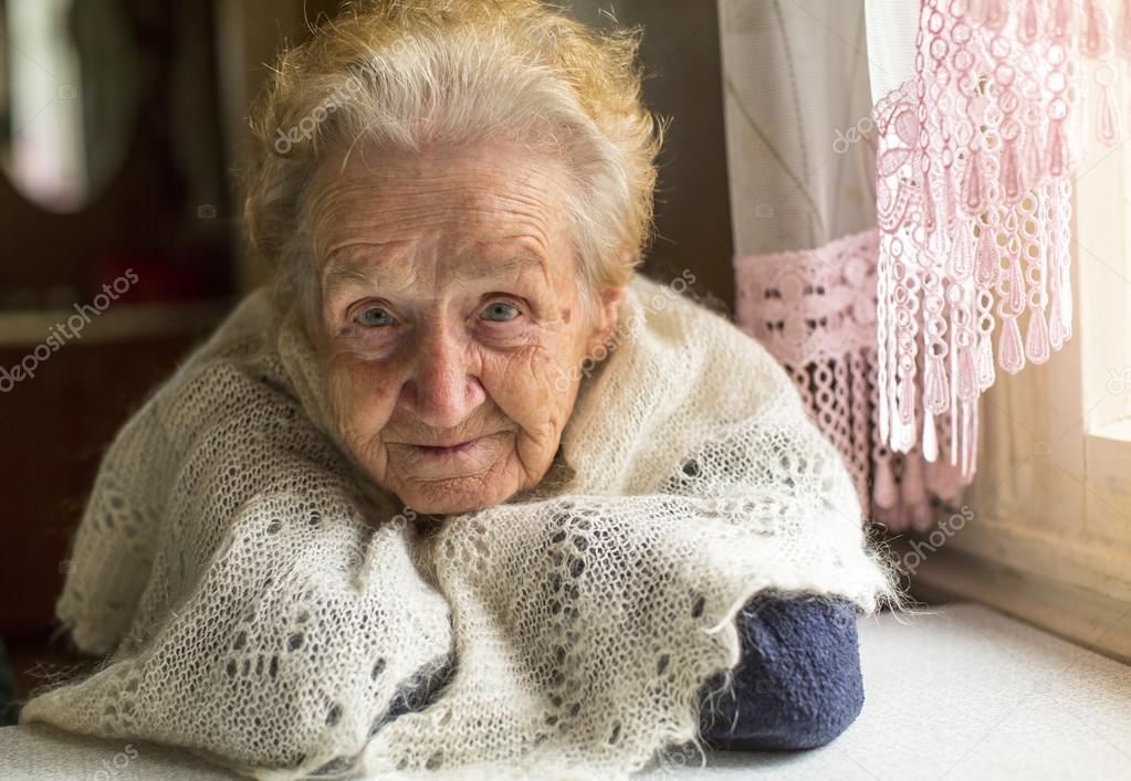 elderly woman near window
