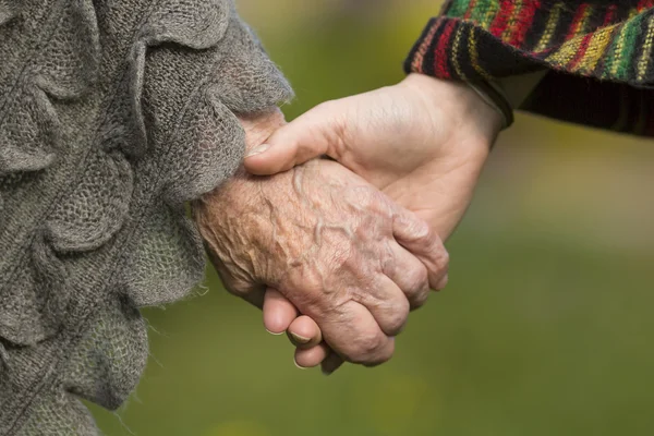 Holding hands together - — Stock Photo, Image