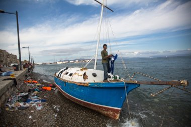 Unidentified refugee on a beach