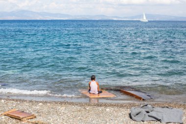 Unidentified refugee on a beach