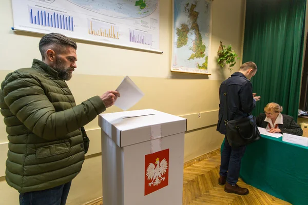 Unidentified voters at the polling station — стокове фото