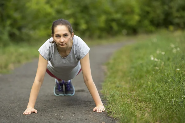 Young woman doing morning jog — Stok fotoğraf