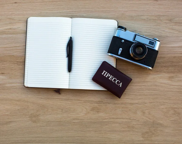 Notepad, film camera and press card — Stock Photo, Image