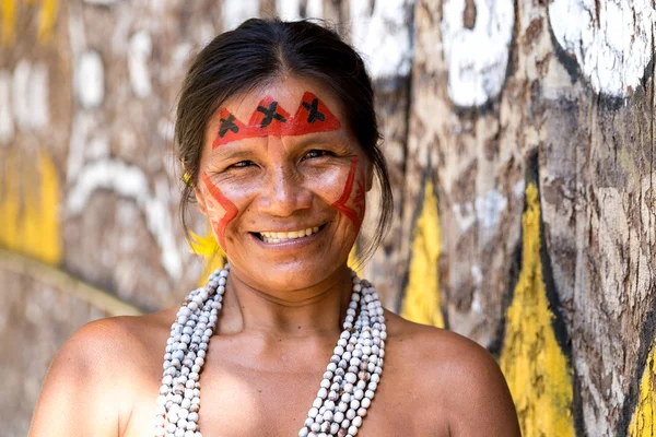 Native Brazilian woman smiling at an indigenous tribe in the Amazon ...