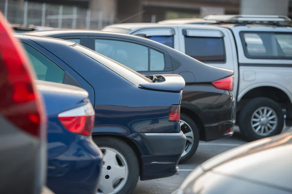 Cars in a row on a parking lot — Stock Photo, Image