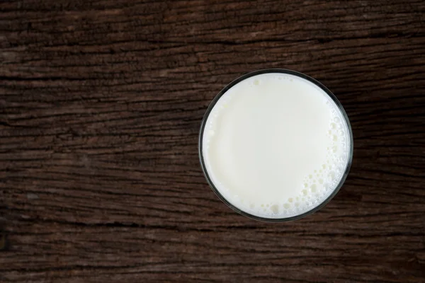 Milk glass on table — Stock Photo, Image