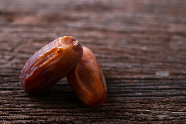 Palm fruit on old wood — Stock Photo, Image