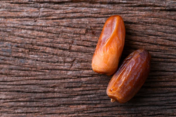 Palm fruit on old wood — Stock Photo, Image