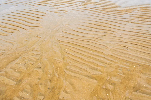 Stranden sand vågor — Stockfoto