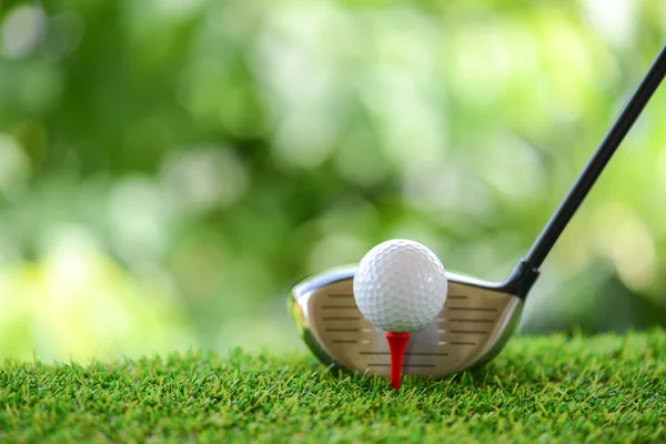 Drive a golf ball on tee — Stock Photo, Image