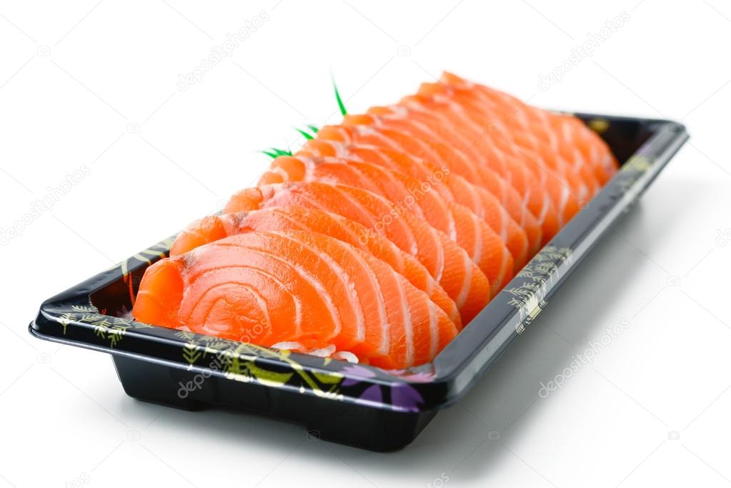 Sliced salmon in plastic box