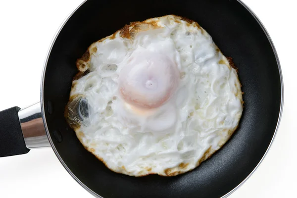 Fried egg in a pan — Stock Photo, Image