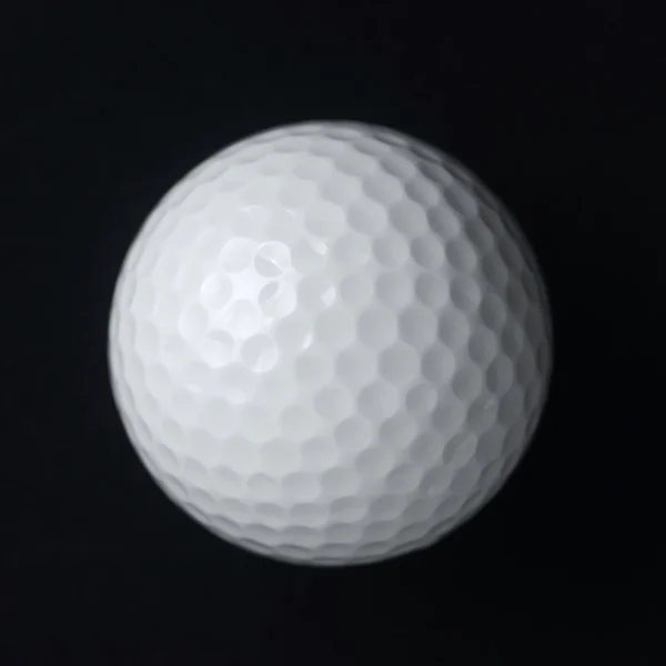 Golf labda fekete háttér — Stock Fotó