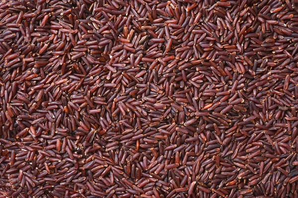 Red rice heap background — Stock Photo, Image