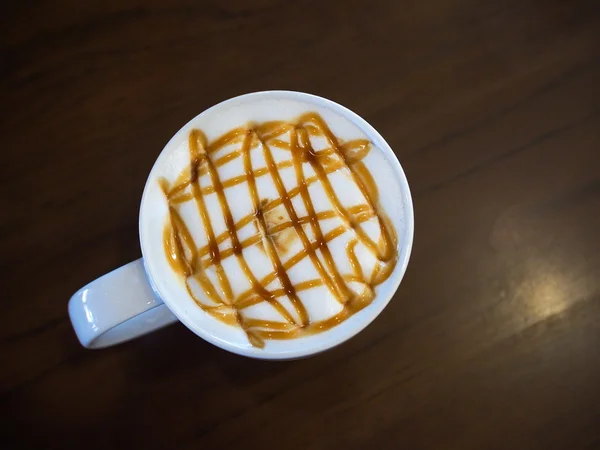 Coffee cup with caramel — Stock Photo, Image