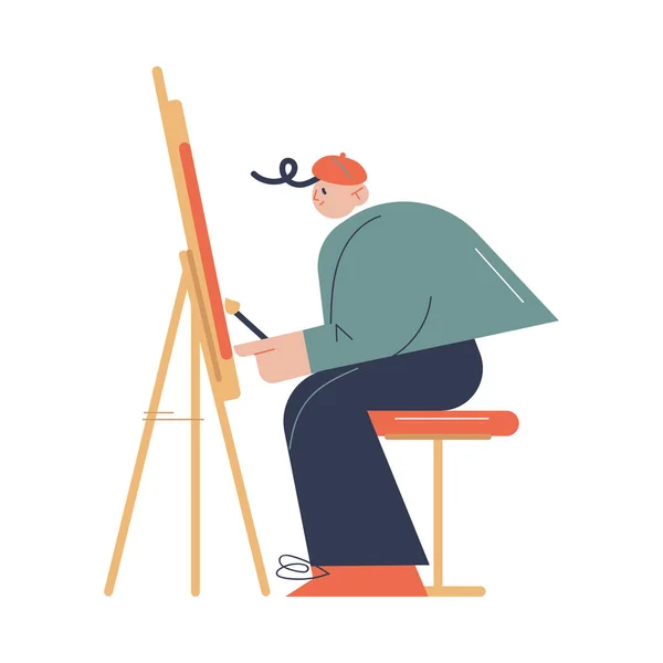 Muž umělec sedí a kreslí na stojanu se štětcem v ateliéru — Stockový vektor