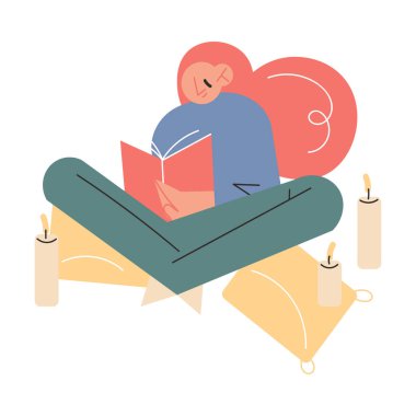 Evde elinde mumlarla oturmuş kitap okuyan mutlu bir genç kız.