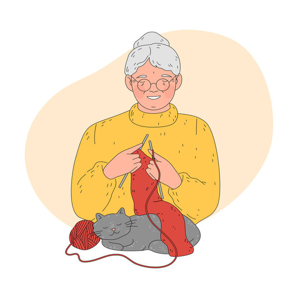 Grandmother in glasses knitting warm red scarf for child with cat relaxing nearby