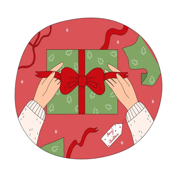 Tangan manusia kemasan dan dekorasi hadiah Natal kotak dengan pita Stok Ilustrasi Bebas Royalti