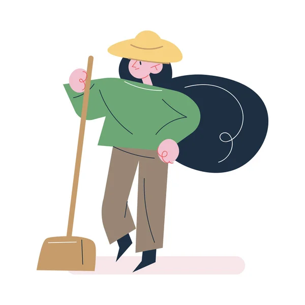 Kobieta ogrodnik w ubraniach roboczych i kapelusz stojący z łopatą — Wektor stockowy